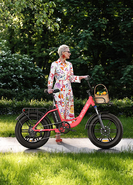 Engwe L20 ebike. woman riding an ebike and basket with fruits in fron rack.